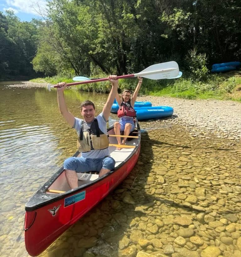 Nick and Maria outdoors in a canoe — Maria Team Cleaning
